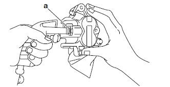 Disassembling the front brake caliper